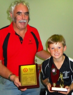Moonee Valley Bowling champion Will Blair with his competition trophy is joined by MVCC president and NWMCA junior official Charlie Walker with the Club's premiership plaque.